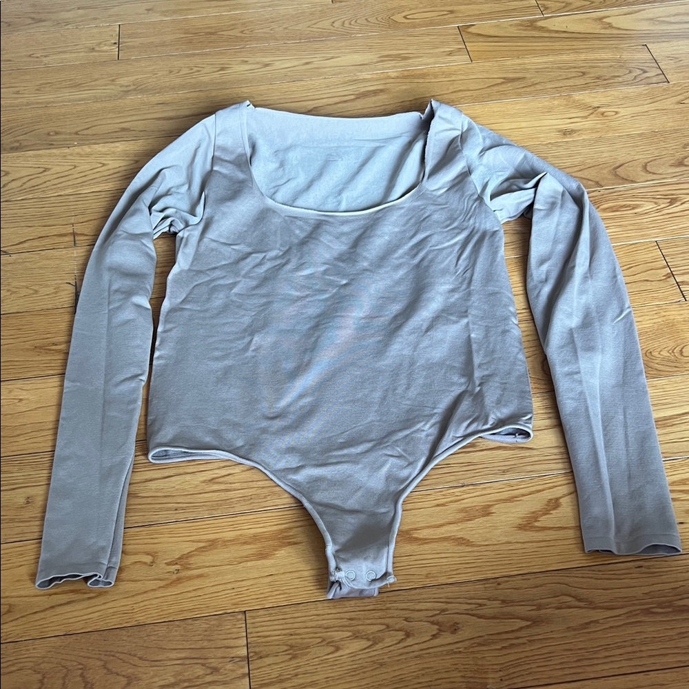 Skims long sleeve, thong bodysuit. Scoop neck
